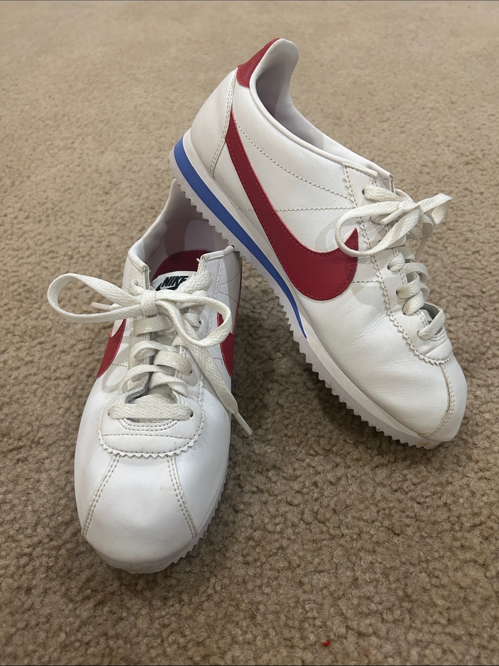 Nike Women’s Cortez Sneakers in White with Red Swoosh and Blue Trim